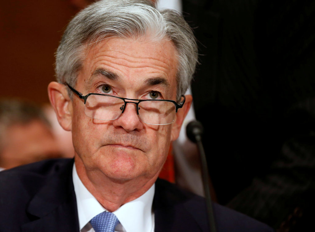 Jerome Powell, Federal Reserve Chairman, at a formal event speaking near a microphone 